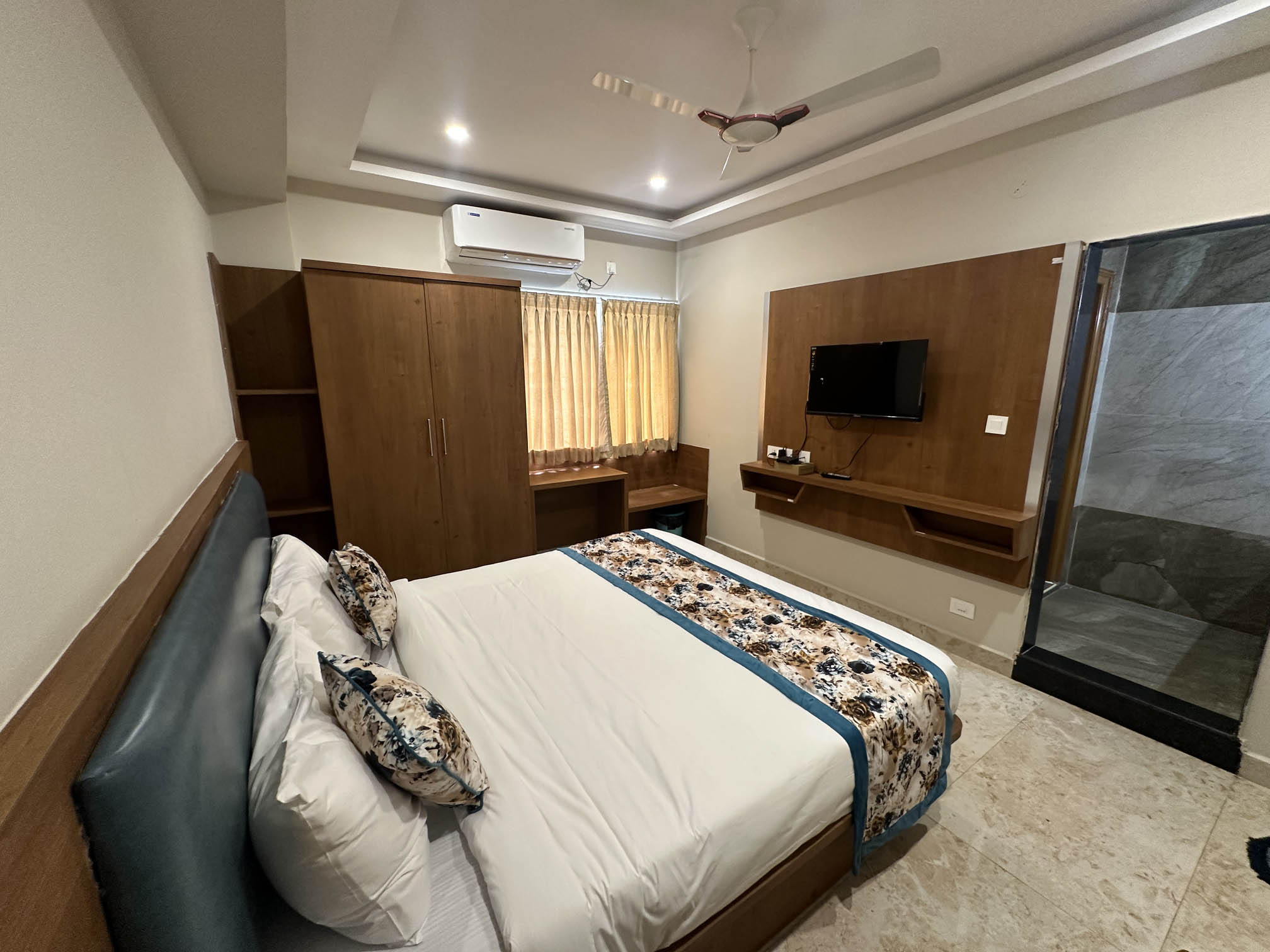 Deluxe Double Room with king bed and stunning city view at Plaza Tower Hotel Tirupati near Tirumala Temple
